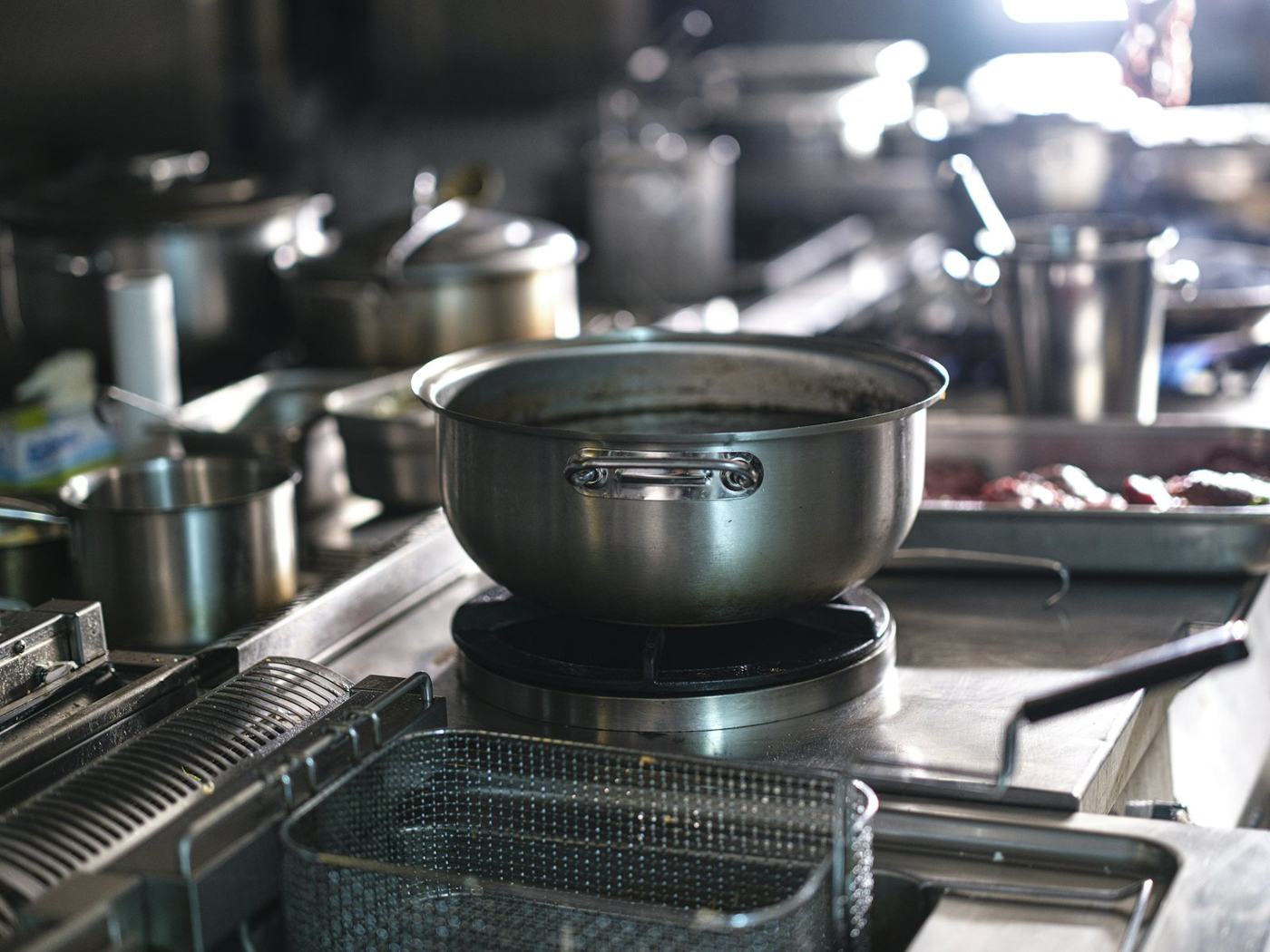 Stainless steel pots on a commercial range